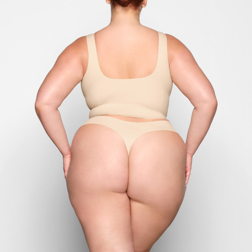 Skims FREE CUT MID WAIST Thong Bruin | 82ZPCYFRM